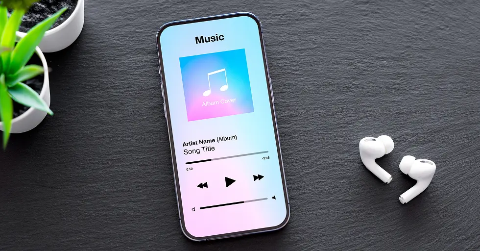 a phone with earphones plugged into it