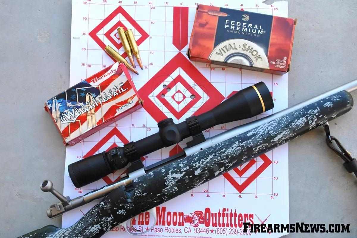 7mm-08 ammo boxes and a target with two nice 3-shot groups and a Kimber rifle.