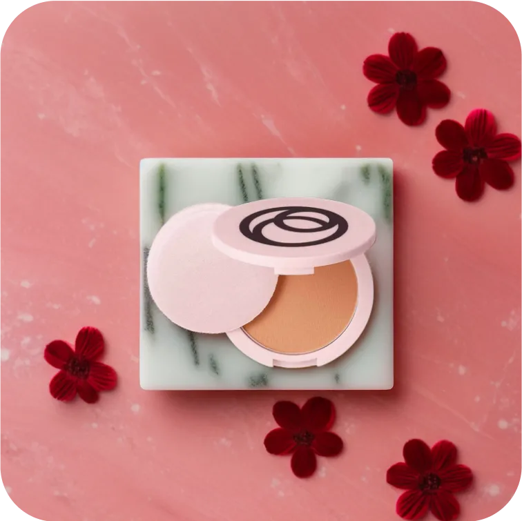 makeup product photos with pink background and flowers
