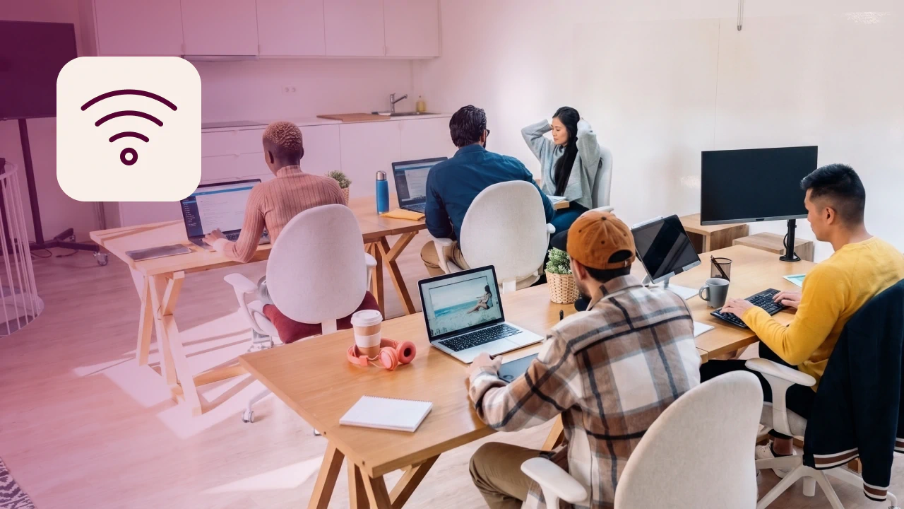 Office employees using wifi at their desks