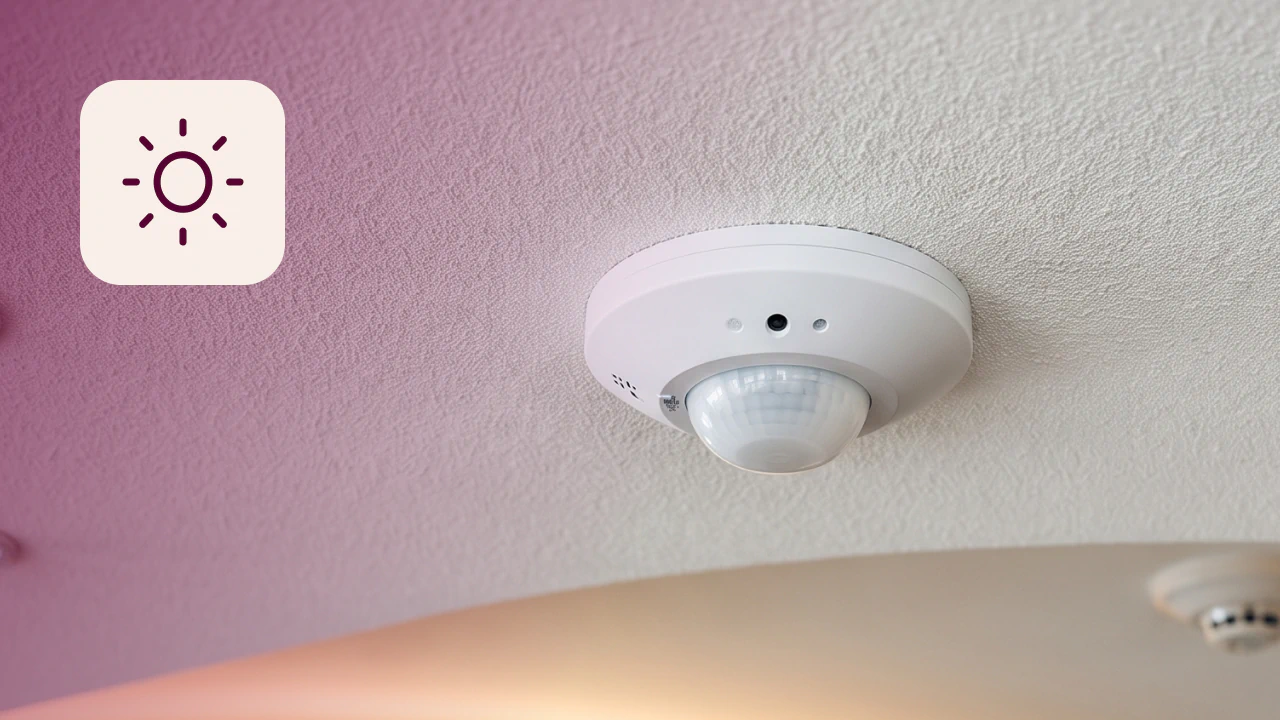 Occupancy sensor mounted on ceiling of office