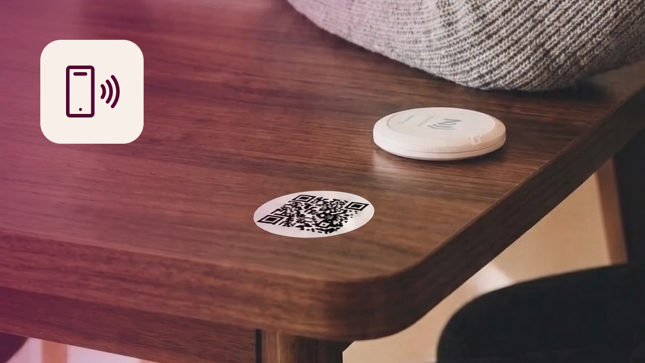QR code sticker and NFC detector on desk