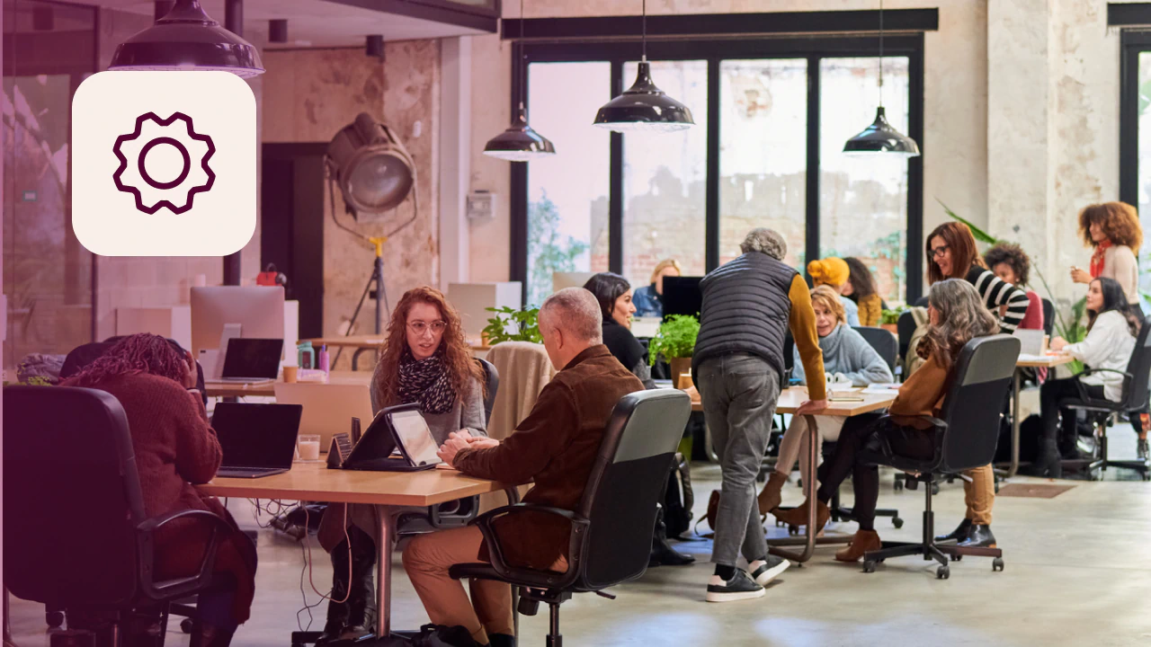 Busy office floor full of employees using custom systems