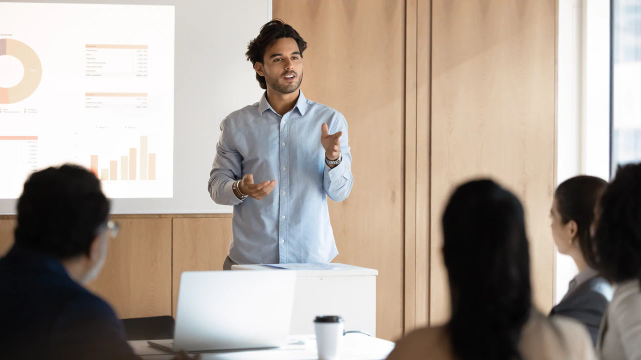 Workplace operations manager presenting business case to executives
