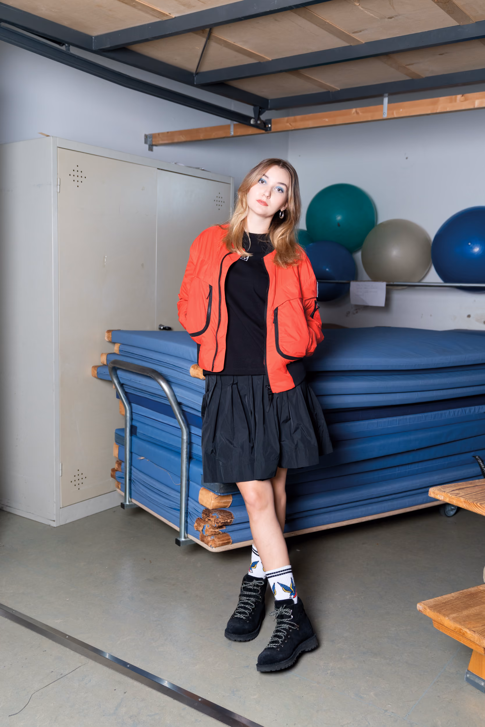 Charlotte wears ultralight padded bomber jacket by Elho Freestyle, column skirt by Lutz Huelle, Elho Freestyle T-Shirt and Roccia Vet boots by Diemme