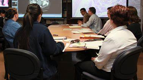 A group of people sitting at a tableDescription automatically generated