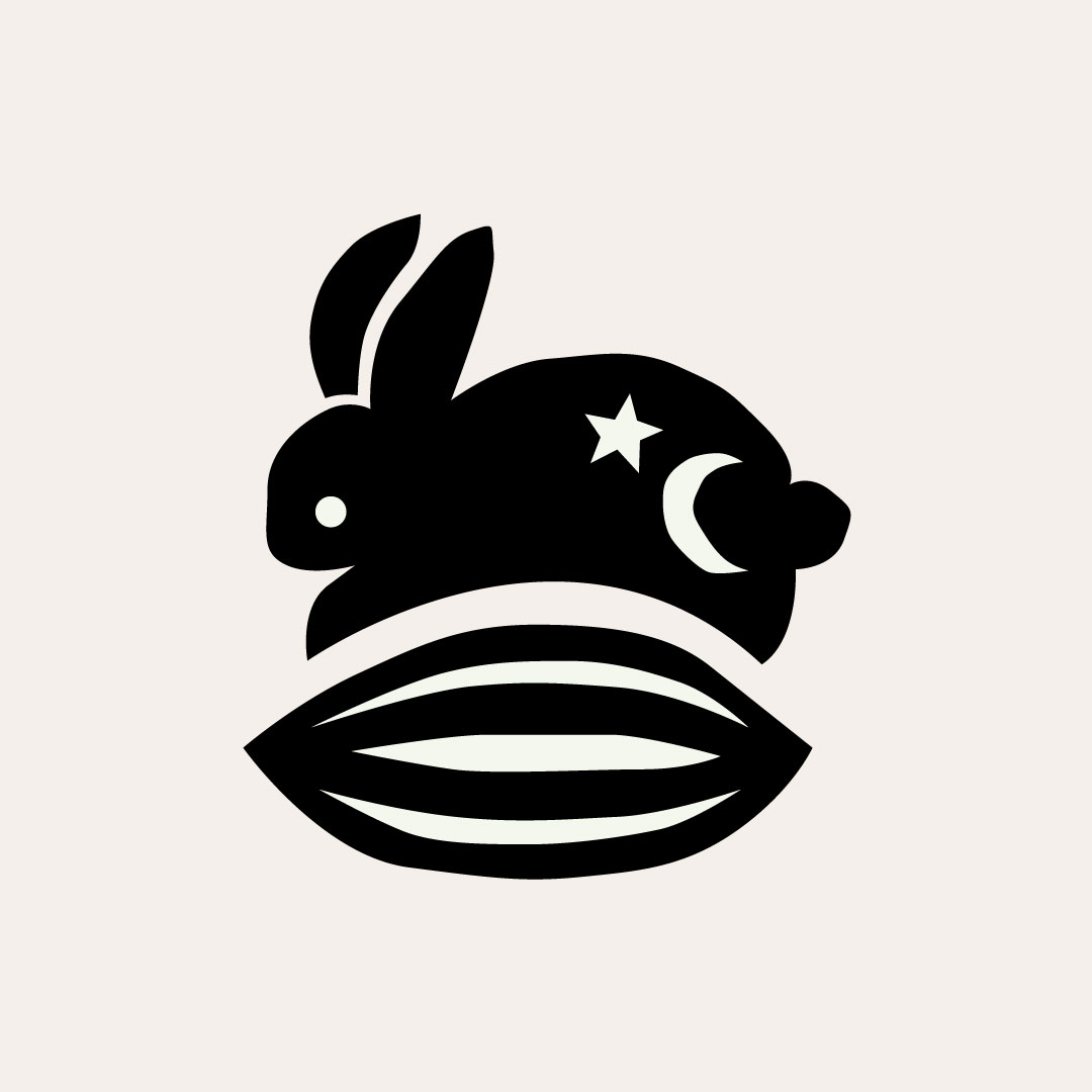 Ritual Kitchen logo of a rabbit and a cacao pod