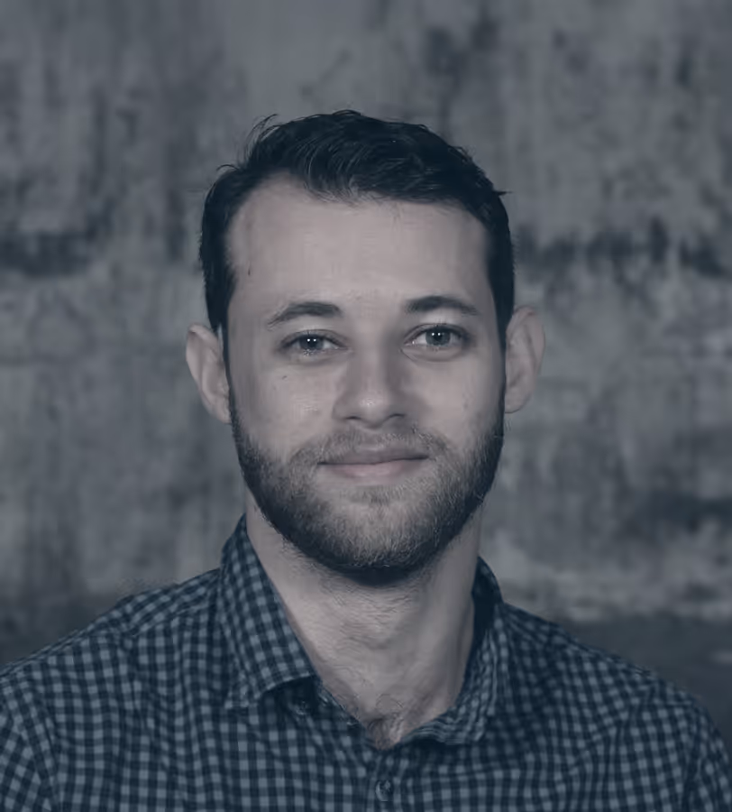 Jeremy in front of a wall