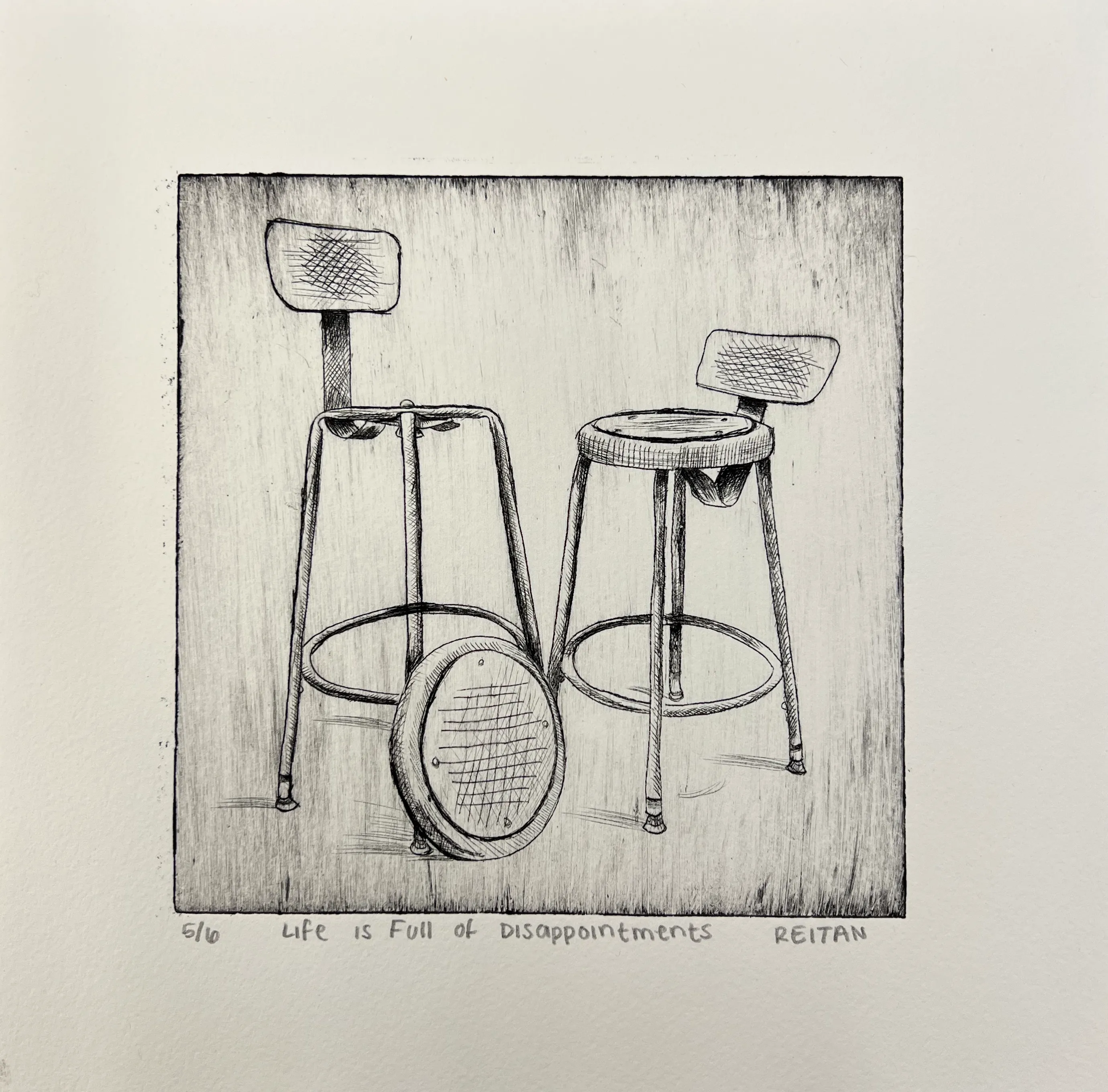 Black and white drawing of two bar stools, one with its seat removed and placed on the floor in front, with the text 'Life is Full of Disappointments' written below.