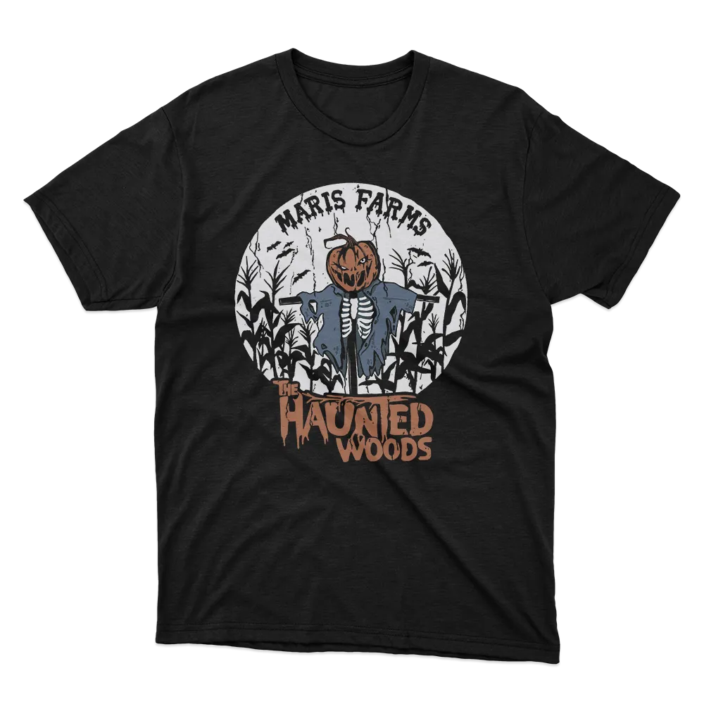 Black t-shirt with a spooky scarecrow featuring a pumpkin head and ripped clothes in a cornfield, with text 'Maris Farms The Haunted Woods'.