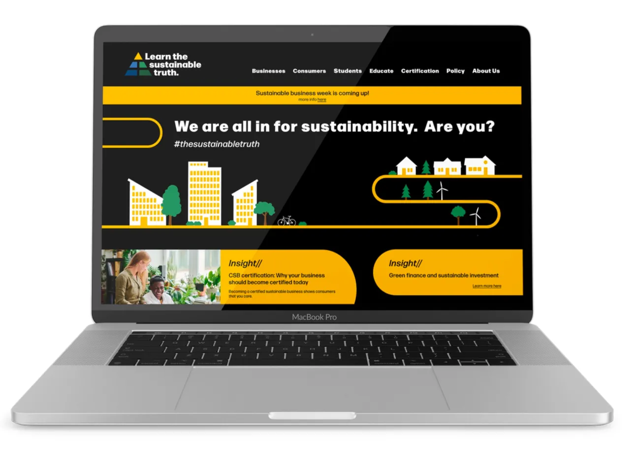 MacBook Pro displaying a sustainability website with a black and yellow theme, featuring the slogan 'We are all in for sustainability. Are you?' and sections about business certification and green finance.