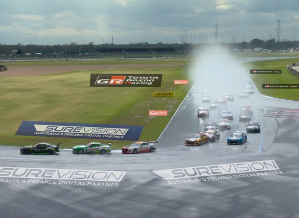 Supercars field at The Bend with SureVision trackside and on-track branding