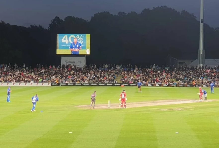Big screen at a night cricket match in New Zealand