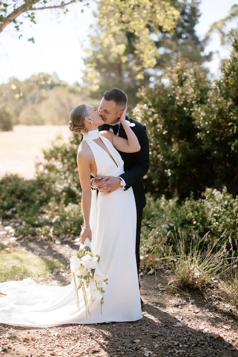 Emotional wedding moment between bride and bridal party