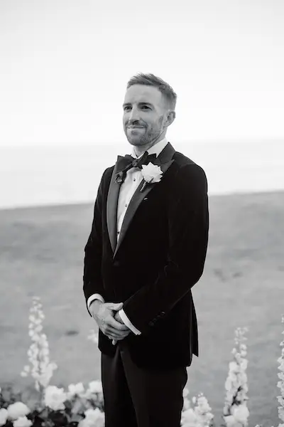 Wedding guests cheering during outdoor ceremony celebration