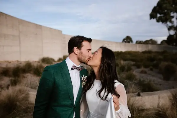 Joyful couple sharing a laugh during their wedding reception
