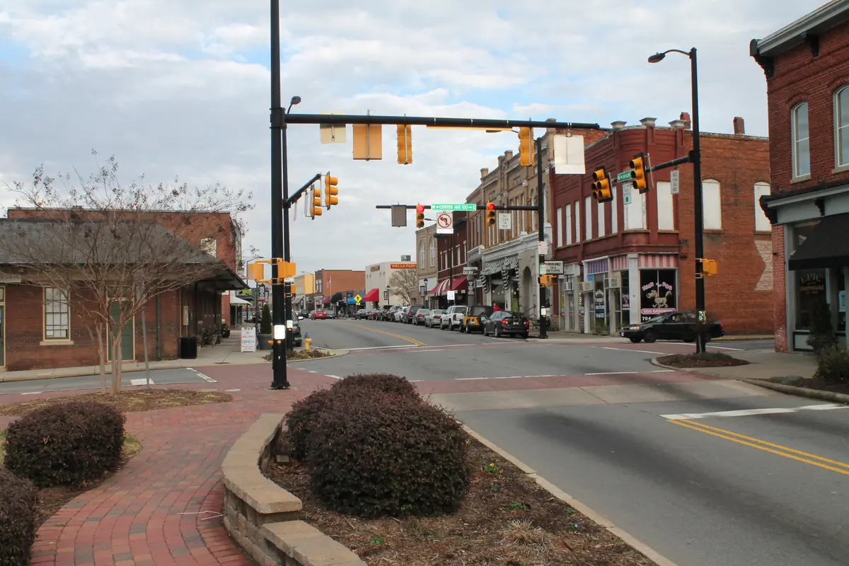 Brick storefronts and the historic train depot along Main Street in downtown Mooresville, North Carolina