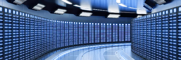 Futuristic data center control room with curved walls of blue illuminated server displays