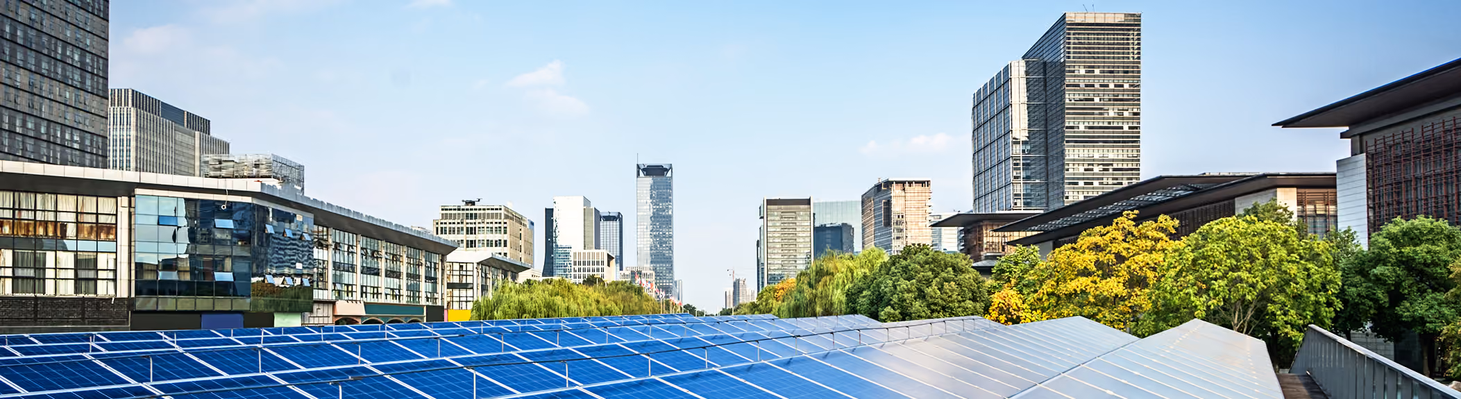 Solar panels against a city scape