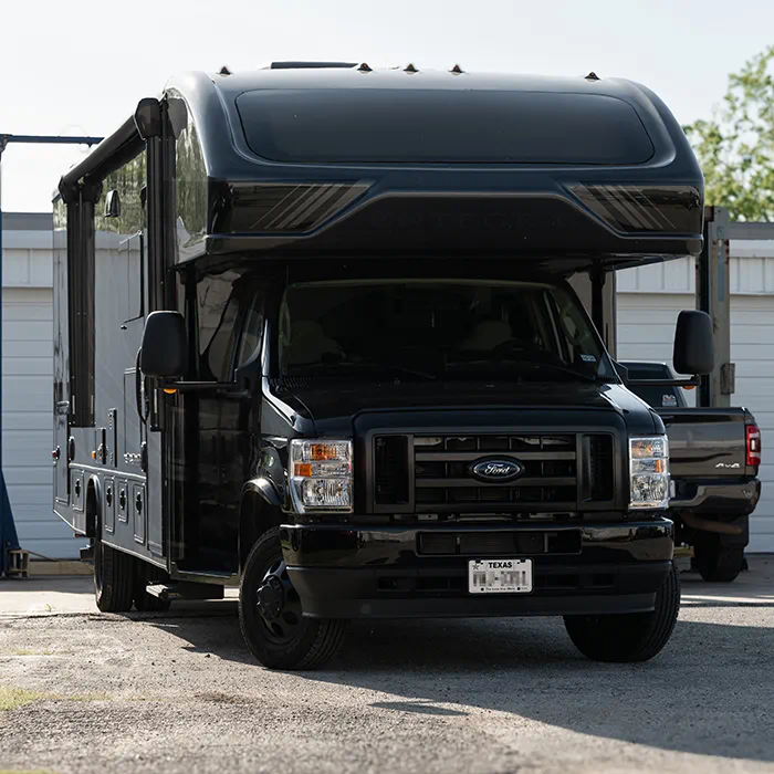 2025 Ford E450 Class C motorhome with WeldTec suspension lift kit installed by Adrenaline Offroad Co. in Tomball TX near Houston
