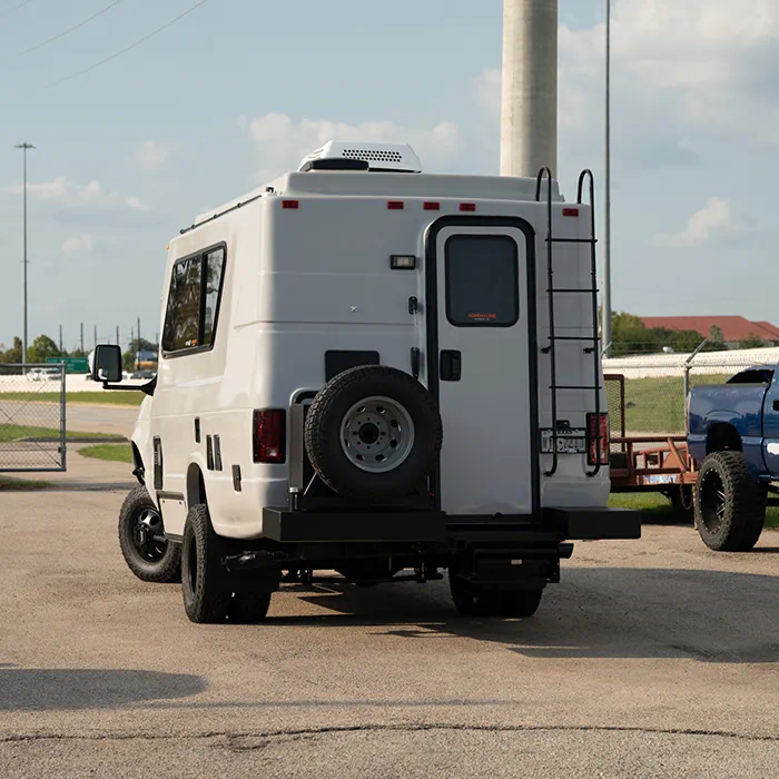 1995 Ford E350 Chinook Class B camper van with WeldTec suspension lift kit installed by Adrenaline Offroad Co. Houston TX