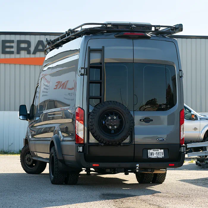 2023 Ford Transit adventure van with WeldTec suspension lift kit, roof rack and spare tire mount at Adrenaline Offroad Co. Tomball TX