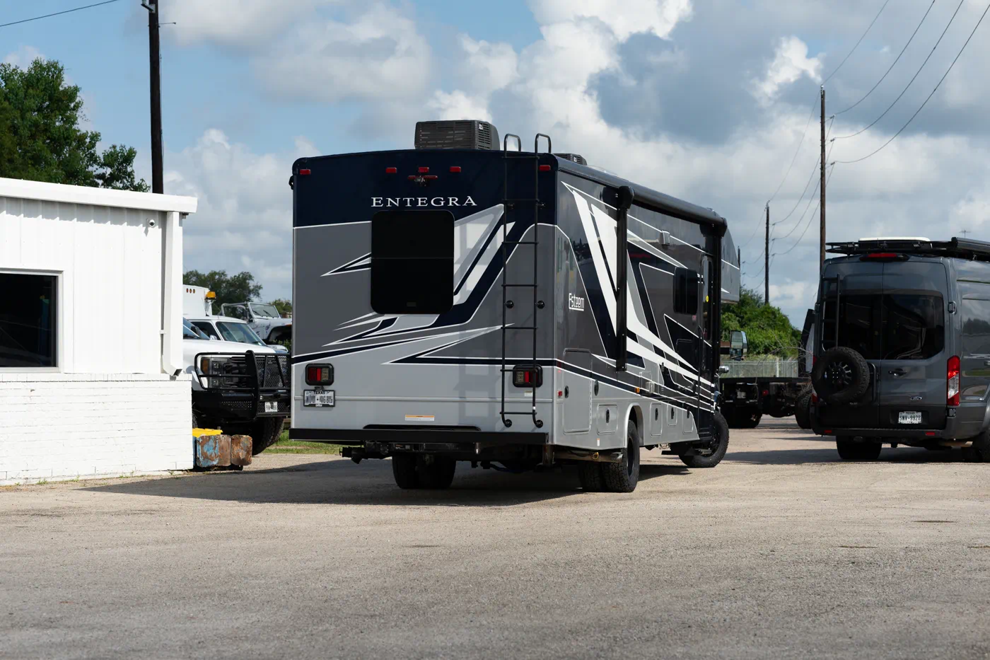 Rear view of 2024 Entegra Esteem Ford E450 Class C motorhome after WeldTec 2" Getaway suspension lift kit at Adrenaline Offroad Co. Tomball TX