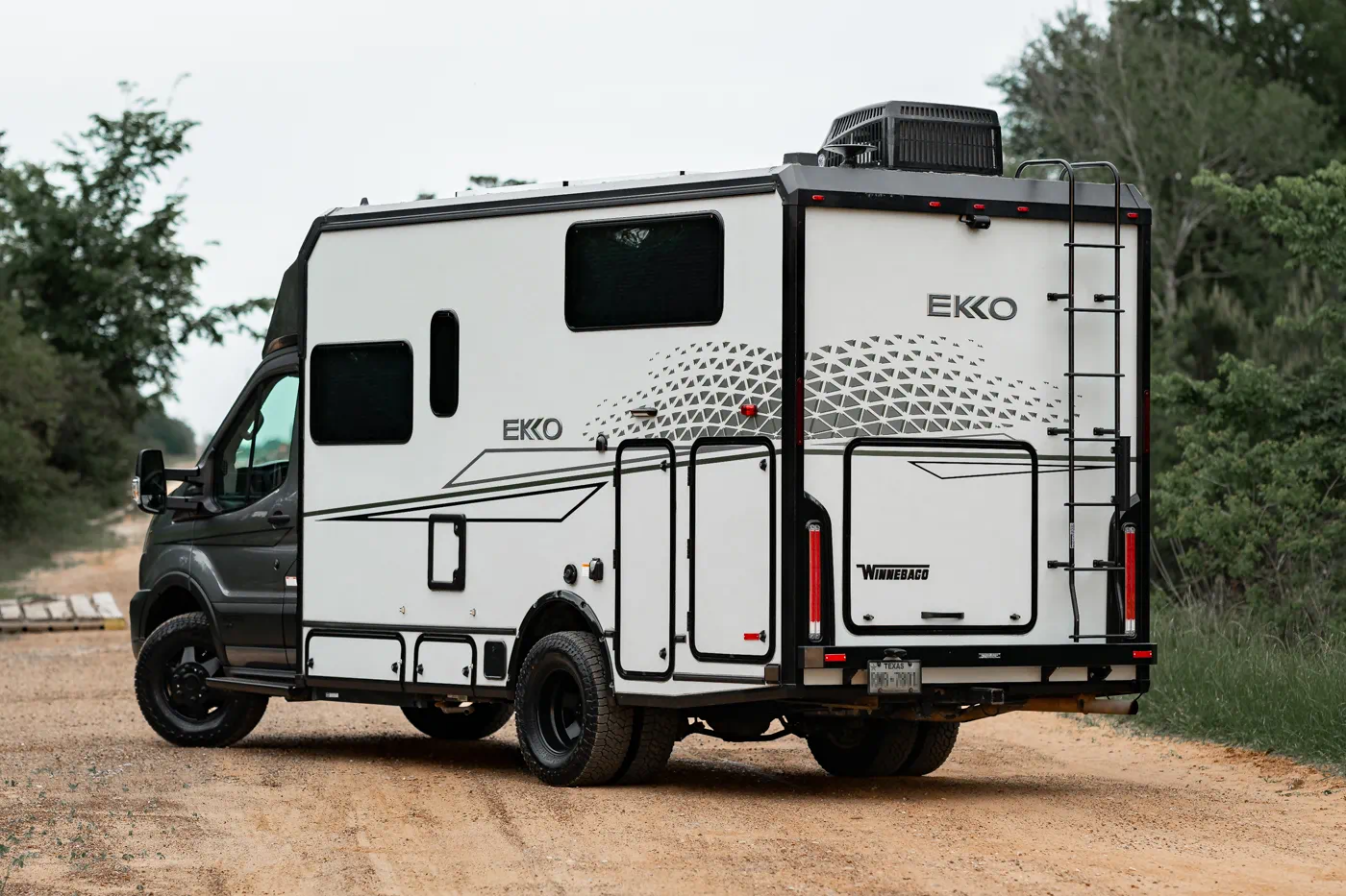 Rear view of 2021 Winnebago EKKO Ford Transit 350 HD Class B+ motorhome with VanCompass suspension lift kit installed by Adrenaline Offroad Co. Texas