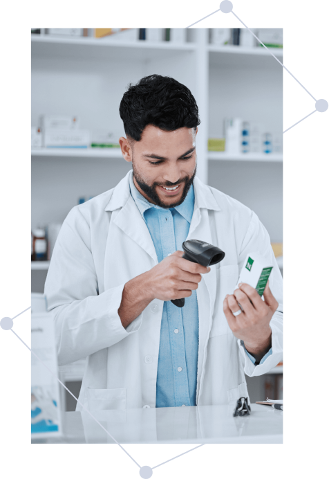 pharmacist using barcode machine to scan a medicine
