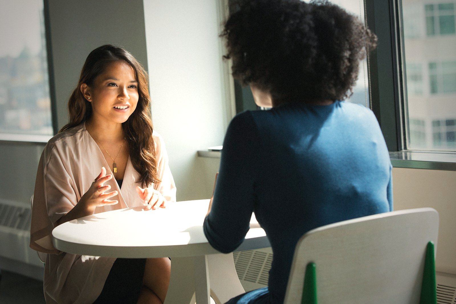 Two people in a candid workplace conversation