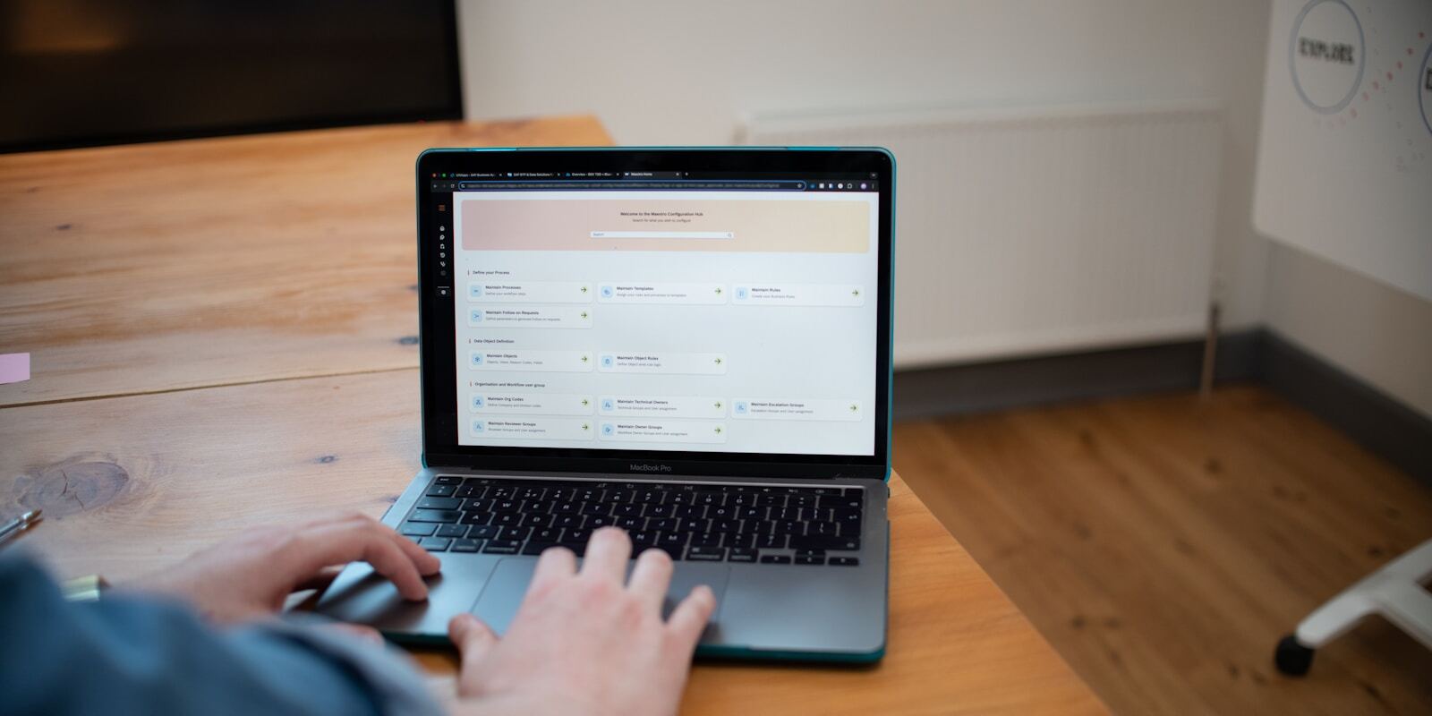 A person using a self-service customer portal on a laptop