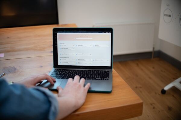 A person using a self-service customer portal on a laptop