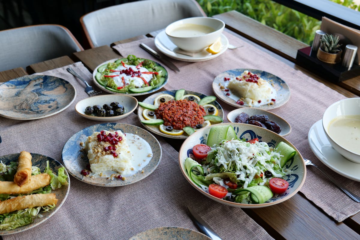 A table with a bunch of food on it made by a private chef