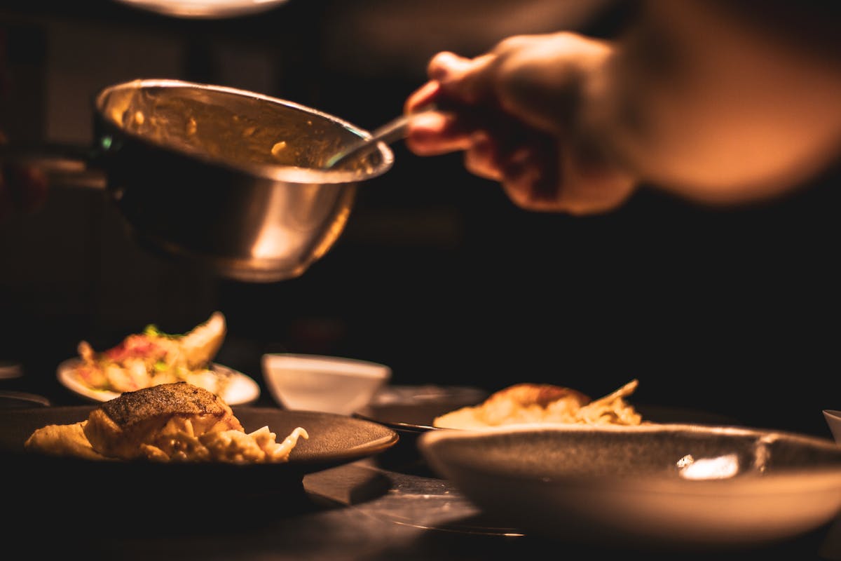 A private chef creating dishes for a customer