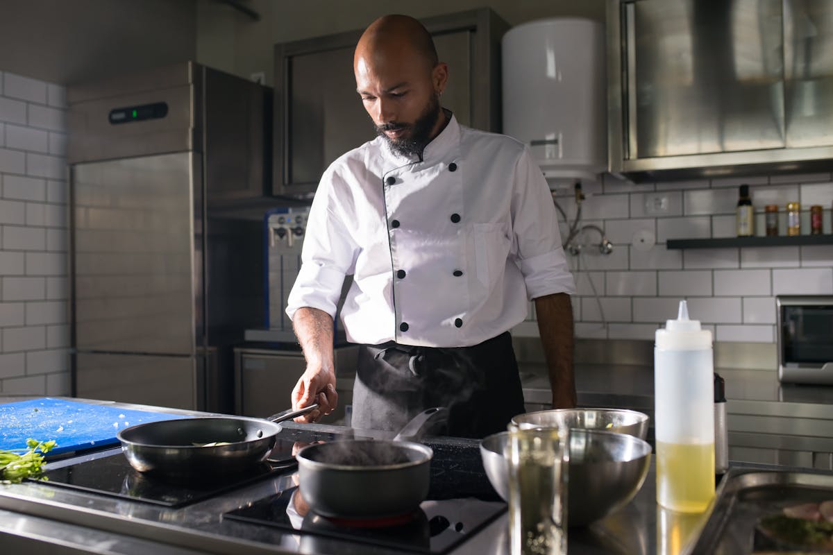 A personal chef cooking up a meal for their employer