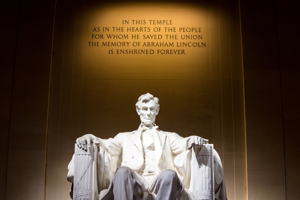 The Lincoln Memorial with a statement behind him