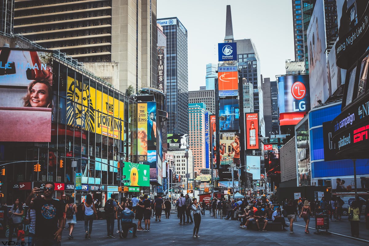 Times Square in New York with a ton of people everywhere
