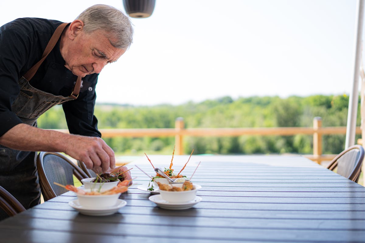 A full time private chef creating some dishes on a table