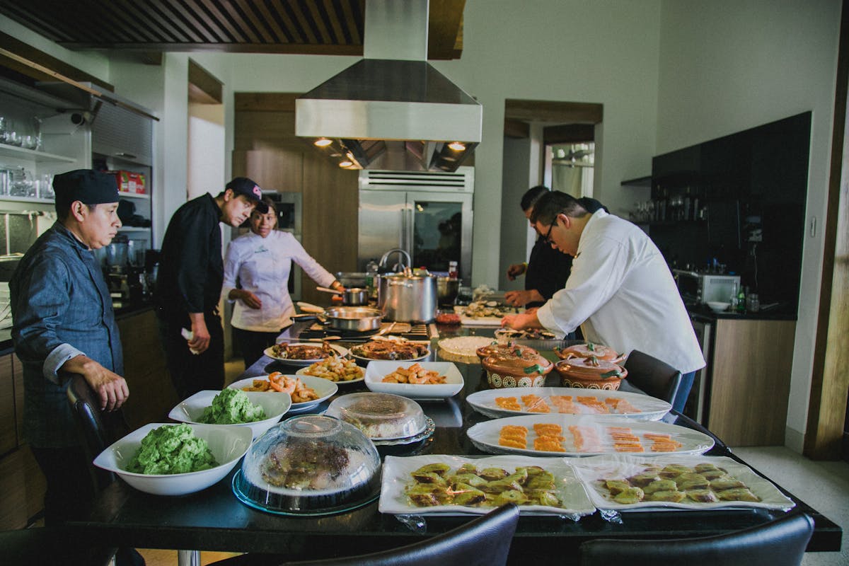 A bunch of chefs creating some food