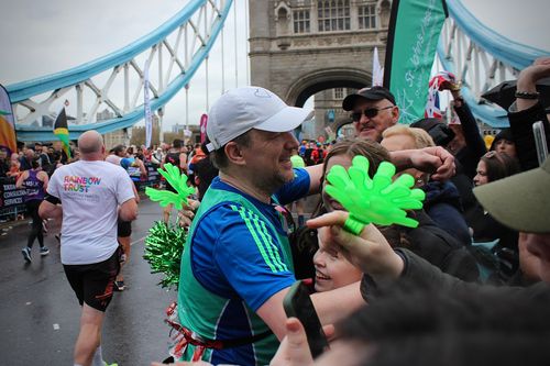 Kealan, pausing to hug his family.