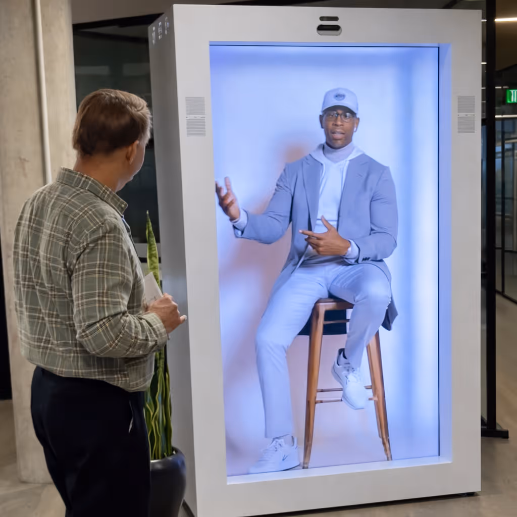 HoloBox holographic display projecting a 3D hologram above the unit creating a floating product demonstration at a B2B exhibition