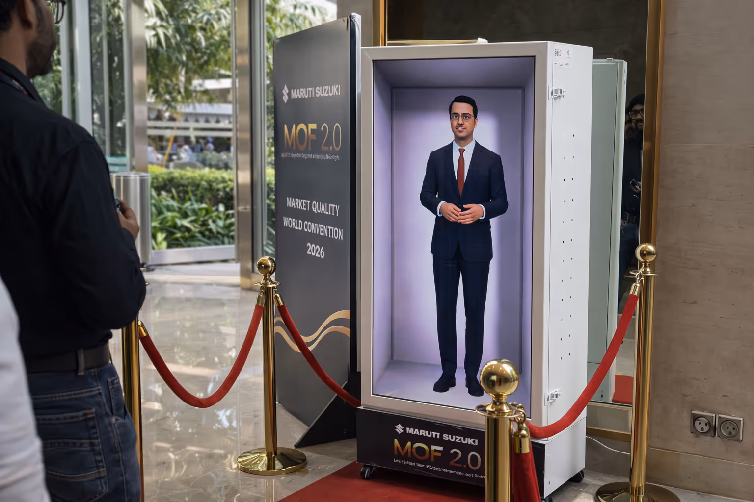 Dealership representative interacting with HoloBox AI hologram in the MQFC 2.0 engagement zone