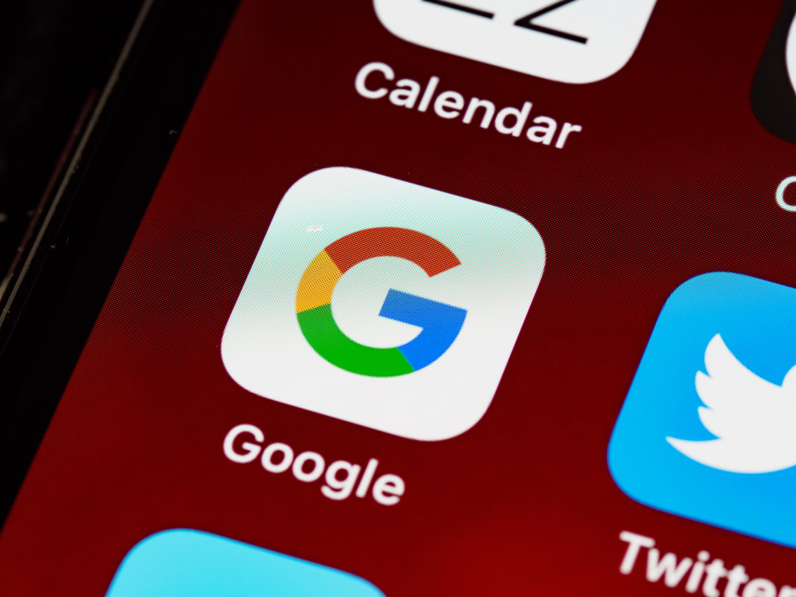 A close-up photo of the Google app icon on a smartphone screen