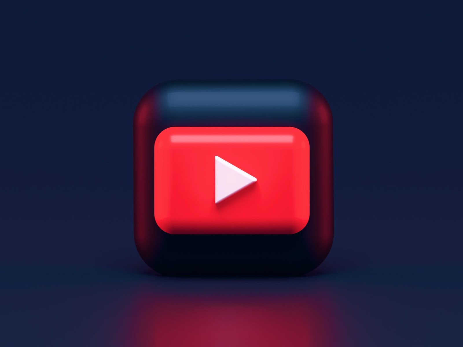 A 3D render of YouTube’s logo on a black cube