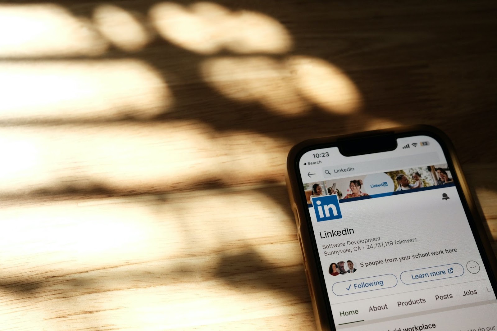 A close-up photo of a smartphone screen displaying LinkedIn’s page on LinkedIn