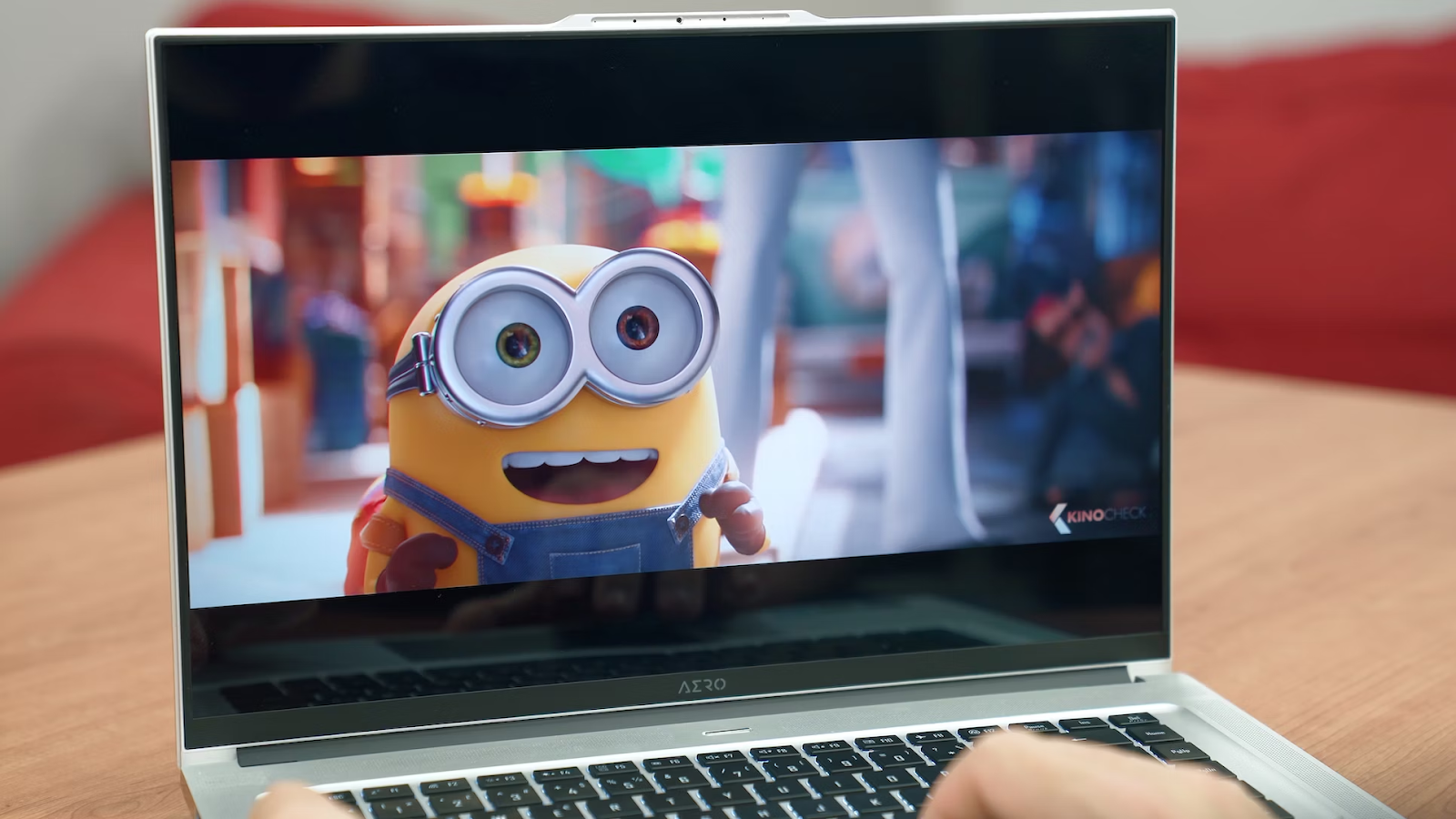 A close-up photo of a laptop with an animated movie playing on it