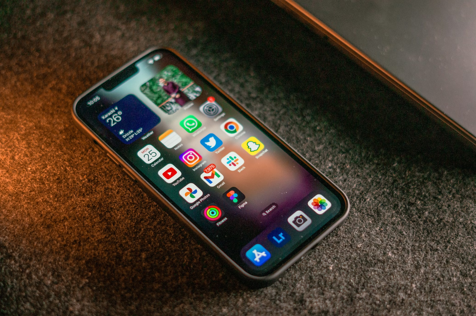 A photo of an iPhone placed on a carpet