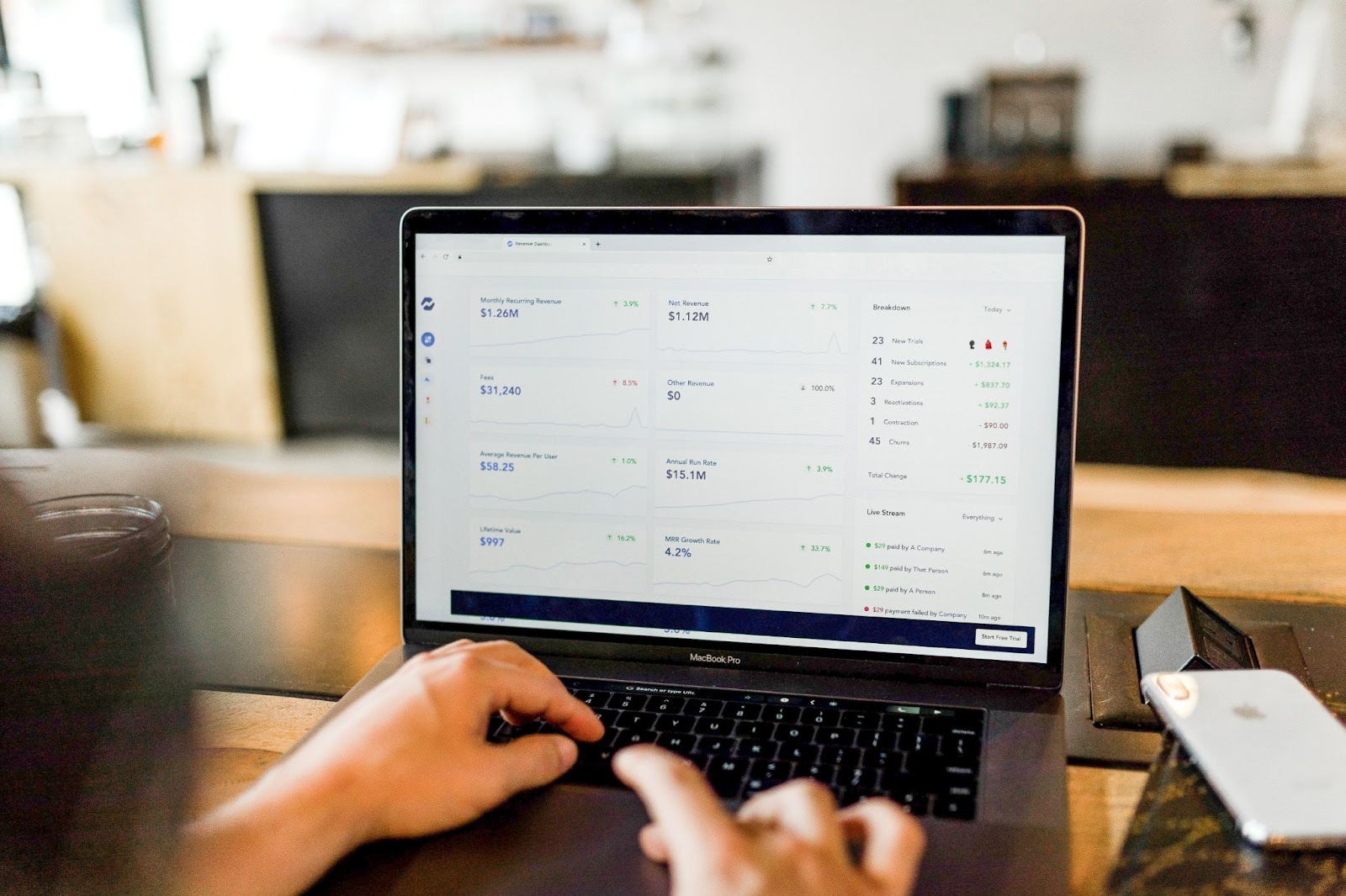 A photo of a person managing finances on a laptop