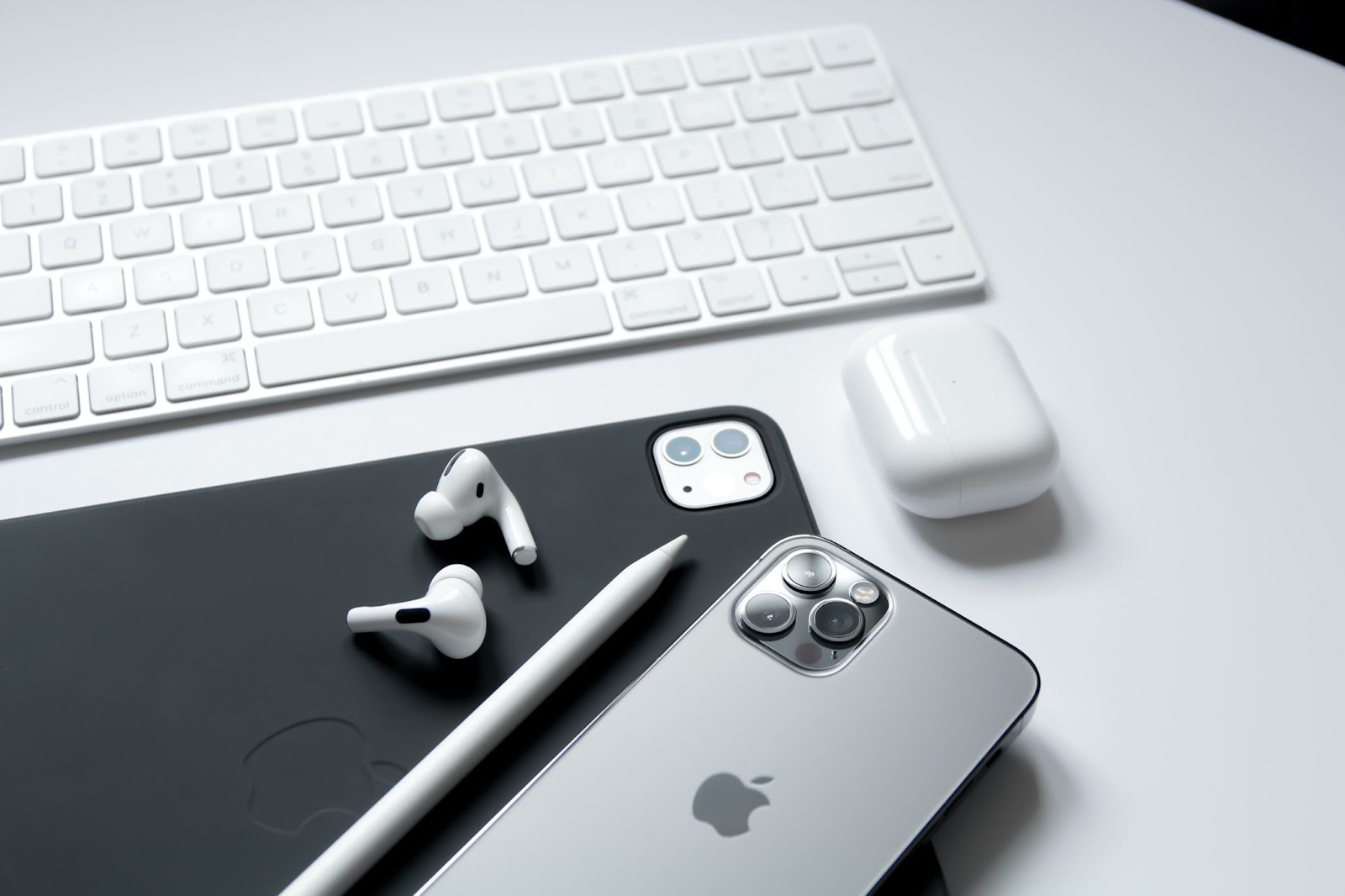 A photo of various Apple devices sitting on a table