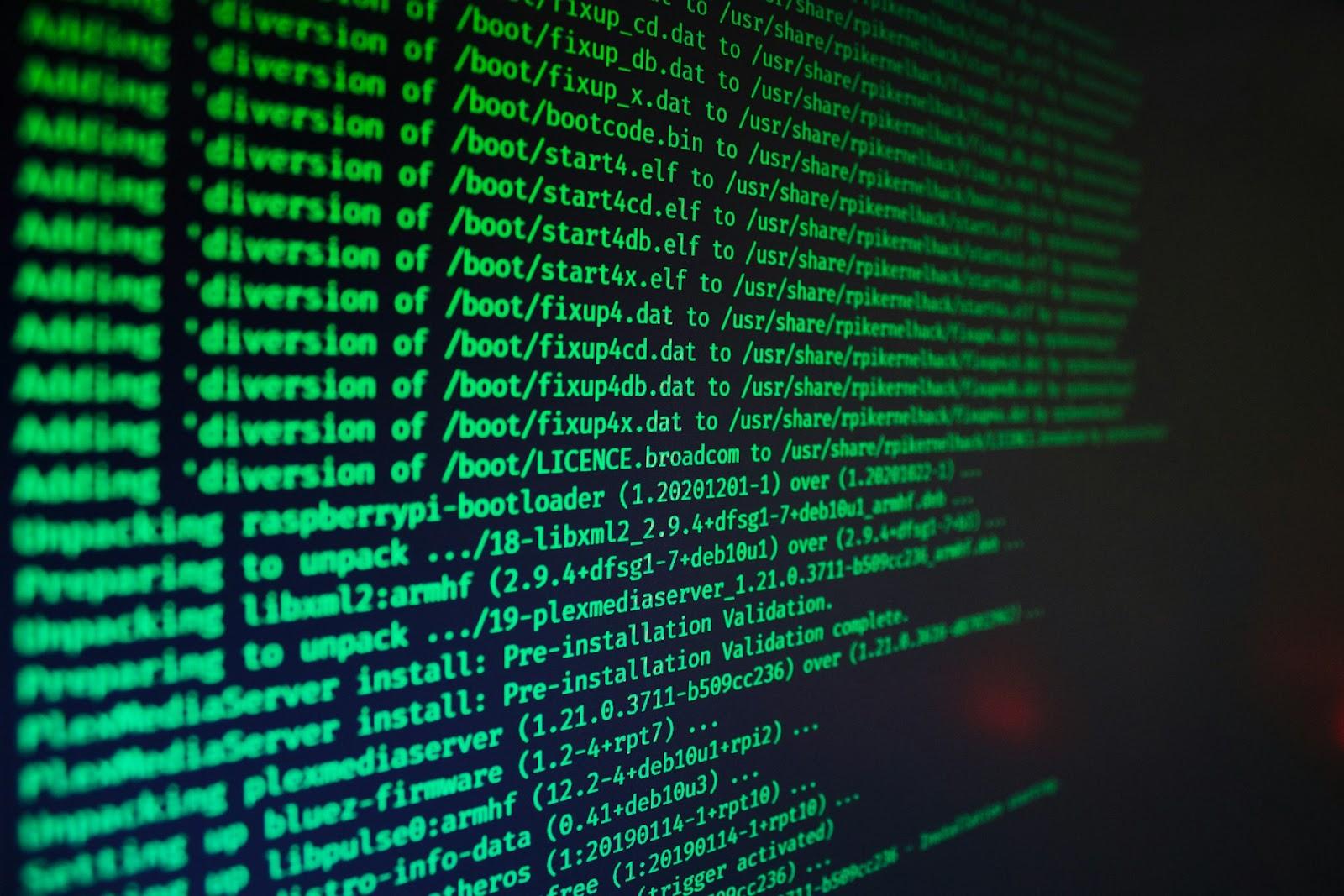 A close-up photo of a Linux command line interface showing system operations with green text on a black background